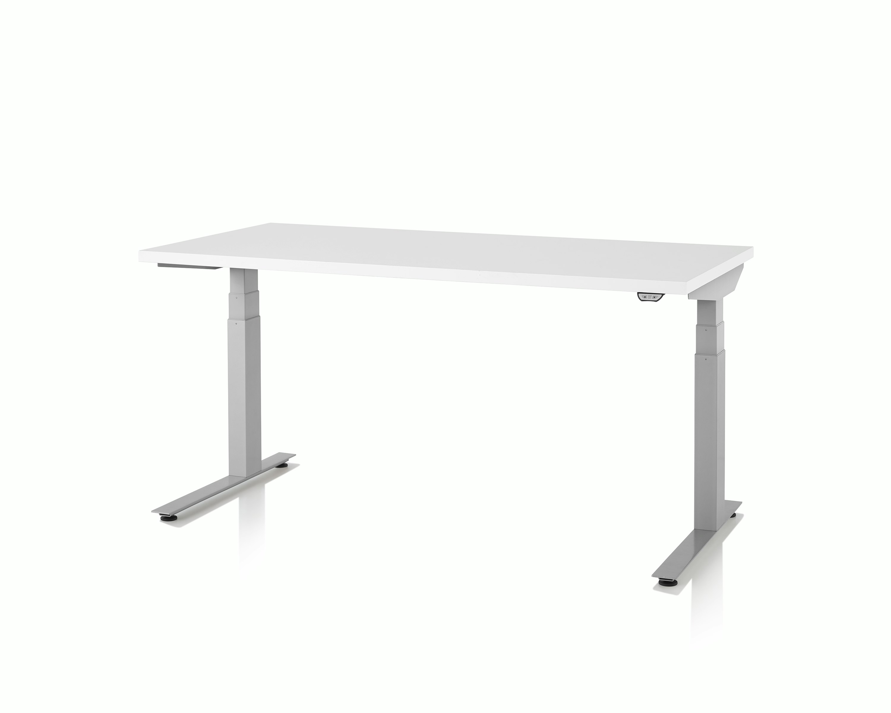 Standing Desk, Nevi Sit-to-Stand Tables, with a white work surface and metallic silver legs, viewed at an angle.