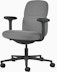 Front angle view of a mid-back Asari chair by Herman Miller in dark grey with height adjustable arms.