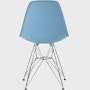 Back of pale blue plastic shell chair with wire base legs.