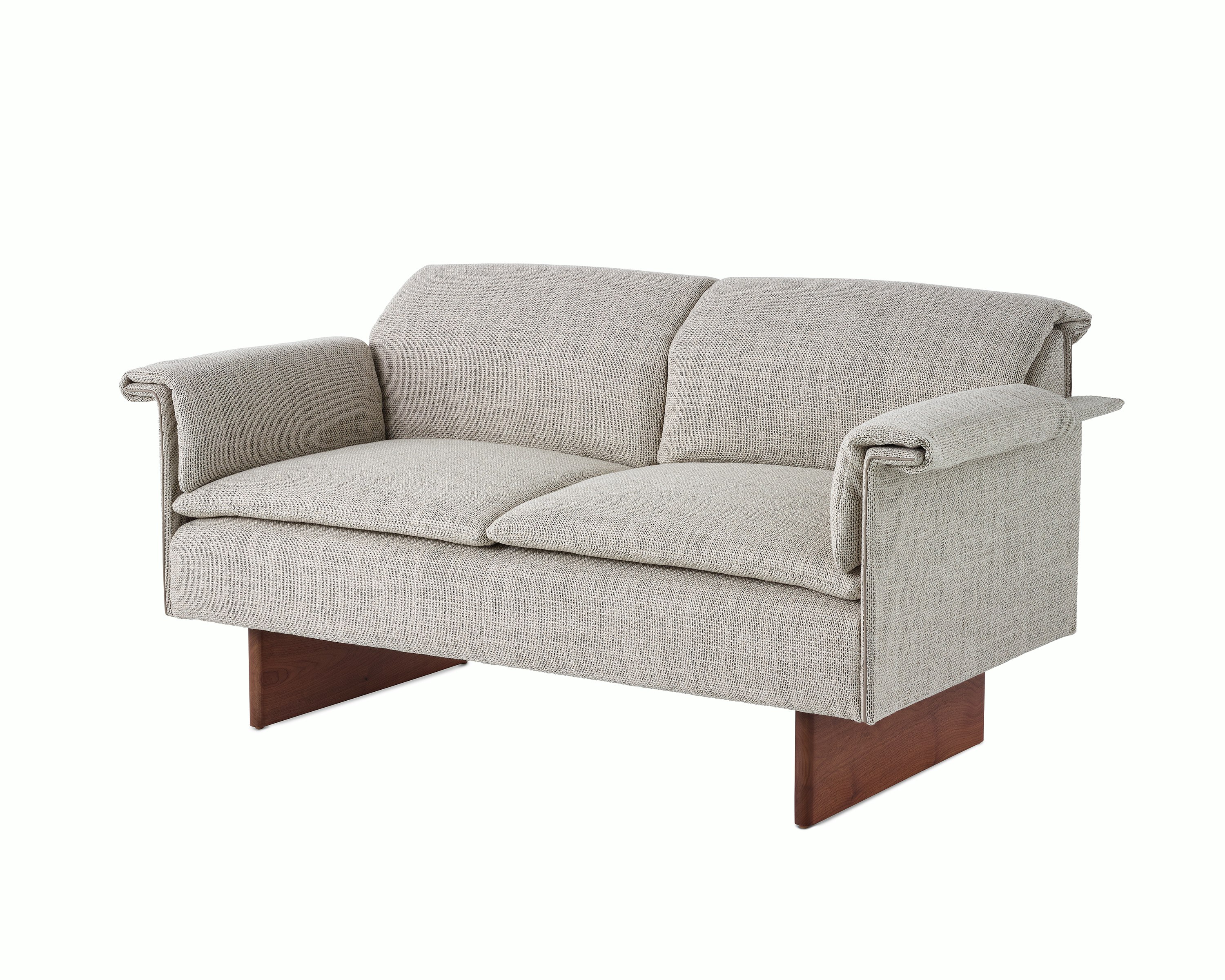 Mantle Two Seater Sofa in Capri Stone with Walnut Wood Base, viewed at an angle.