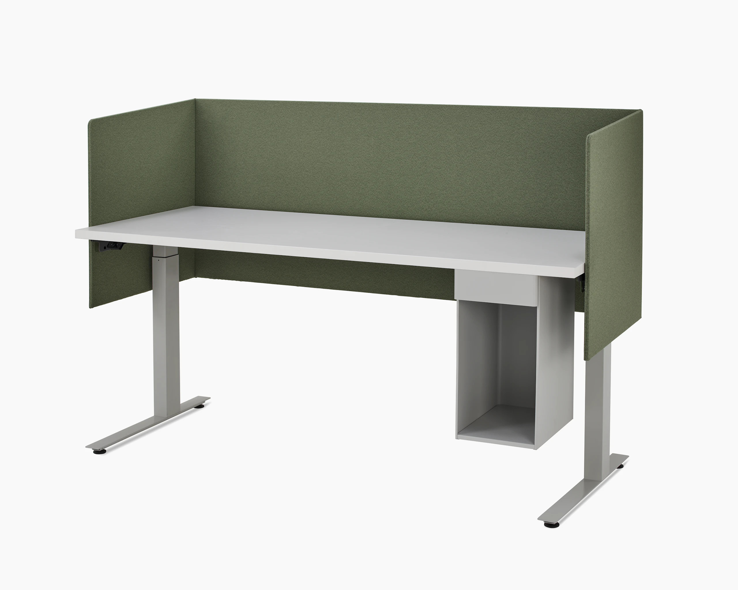 Large, grey metal suspended storage attached to bottom of laminate worksurface of height adjustable table with three sided olive fabric screen.