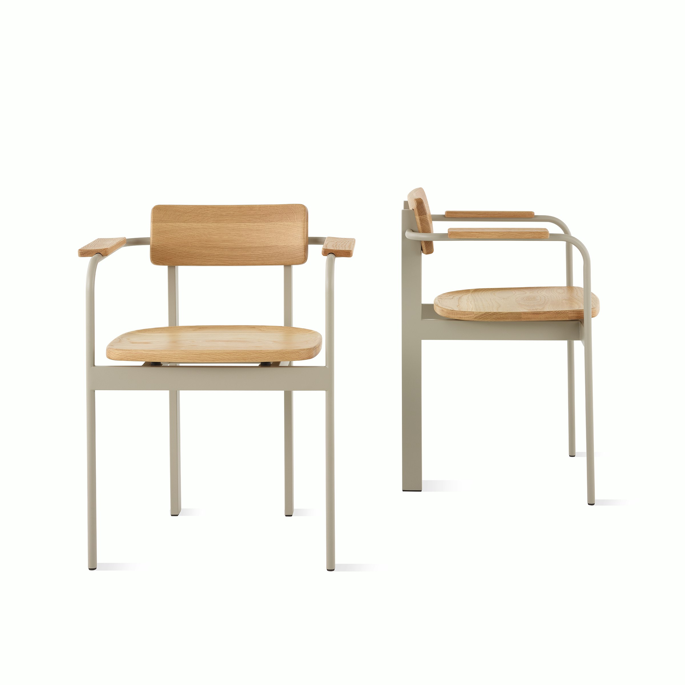 Two Betwixt Chairs with grey frames, oak seats, and backrests.