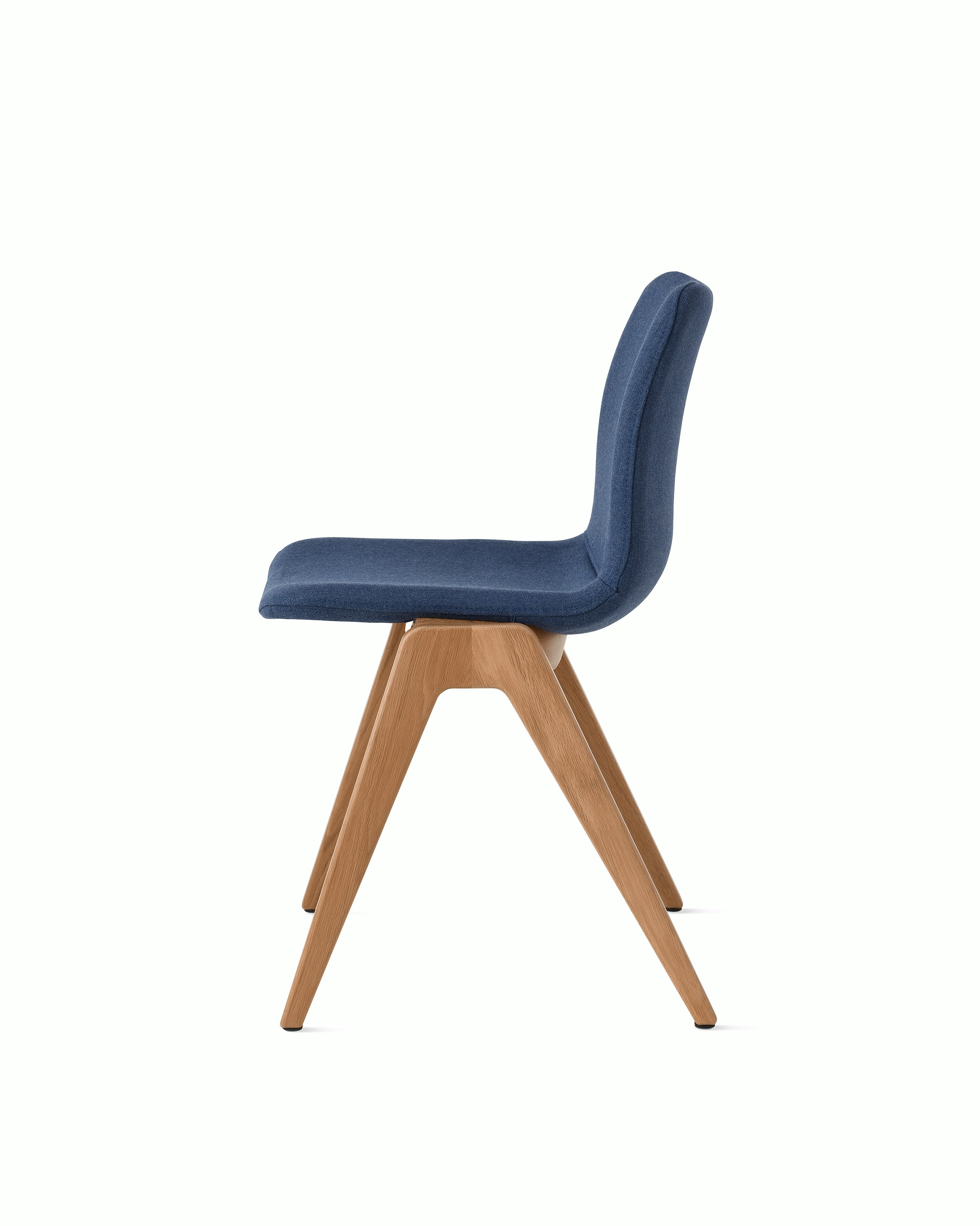White sweep of Viv wood chair with dark blue fabric and 4 leg solid oak wood base