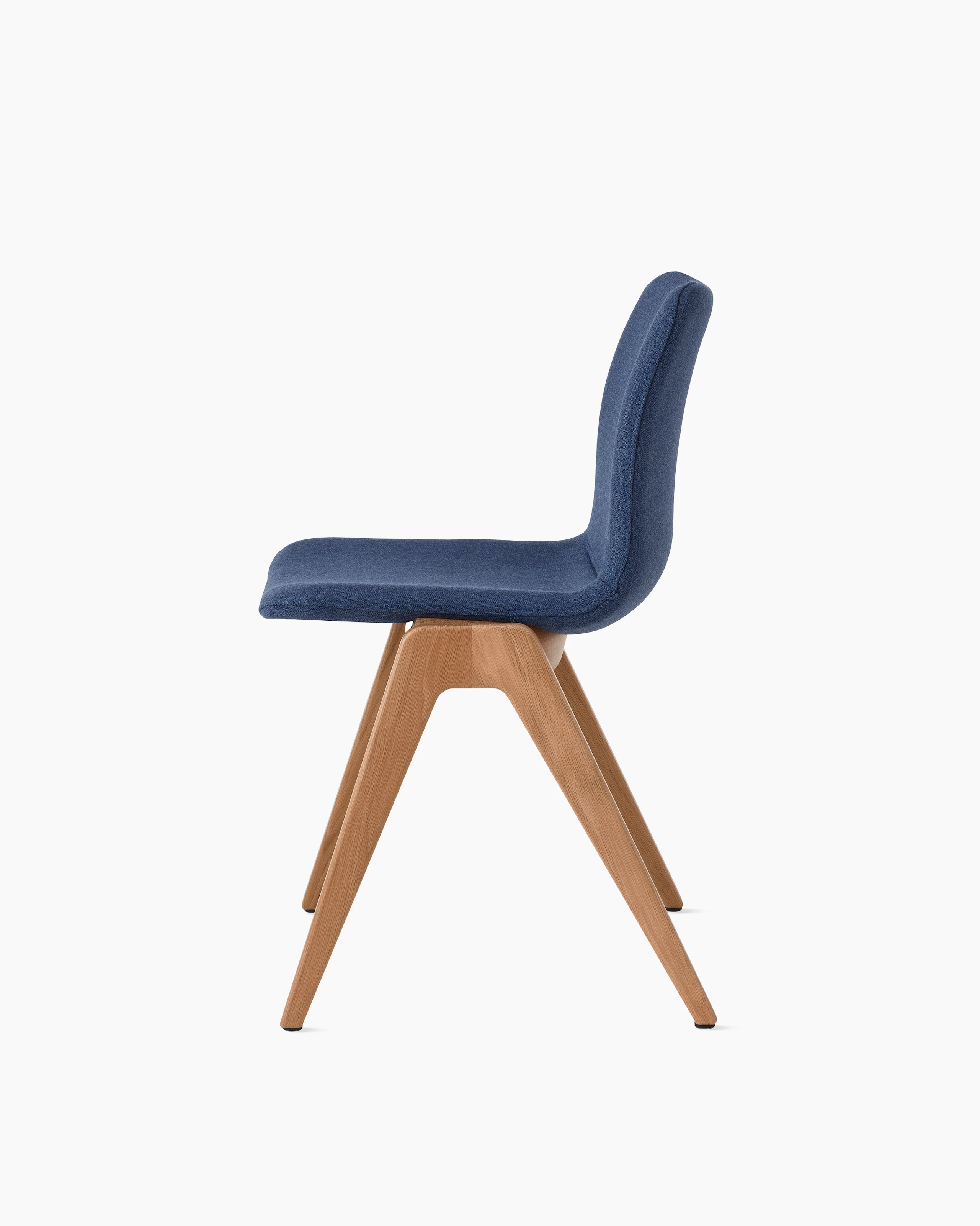 White sweep of Viv wood chair with dark blue fabric and 4 leg solid oak wood base