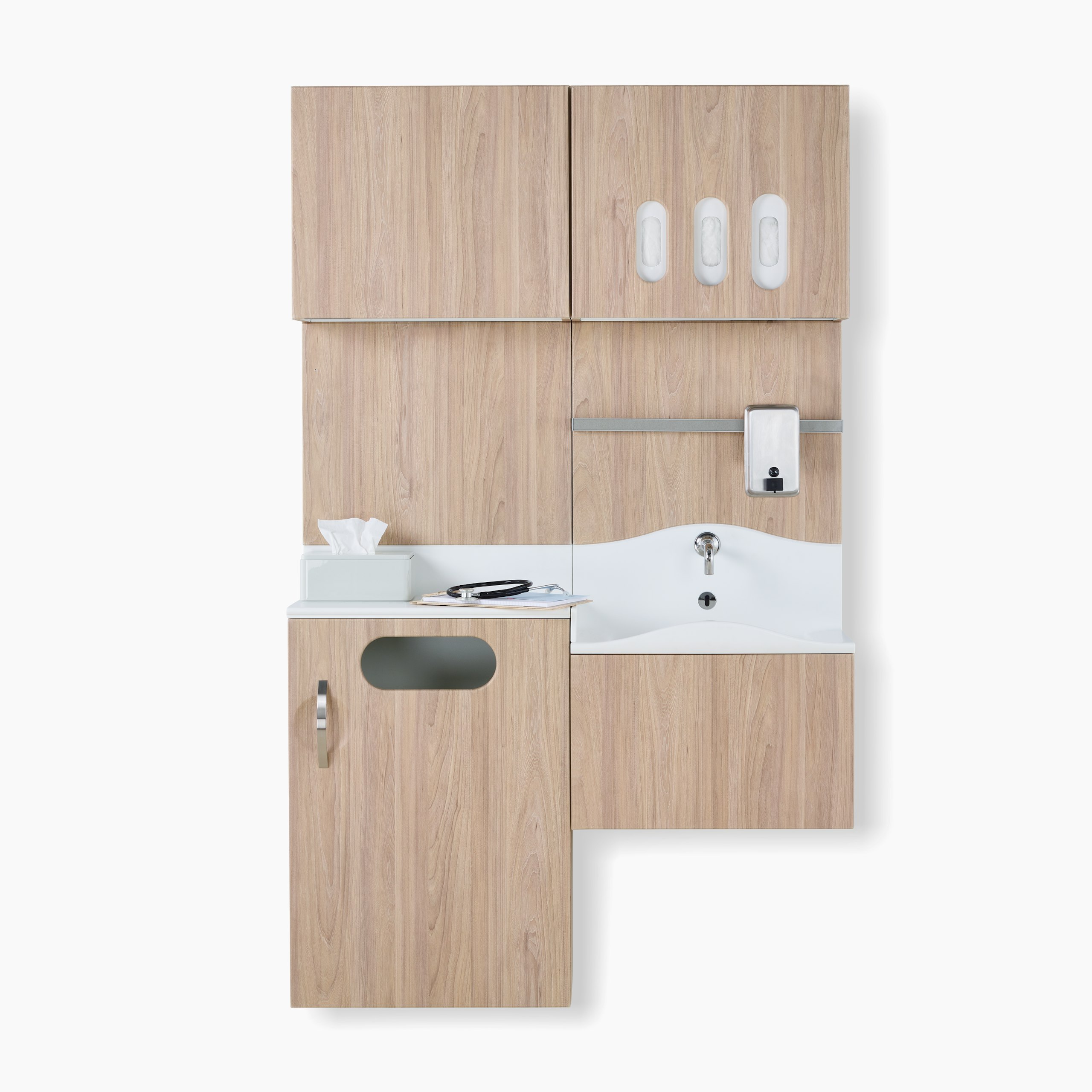 Front view of Compass System casework wall unit in a medium elm wood laminate finish with integrated waste receptacle, white solid surface sink, and upper storage for gloves.