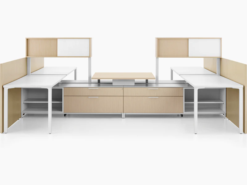 Canvas Dock workstation with white surfaces and light brown storage.