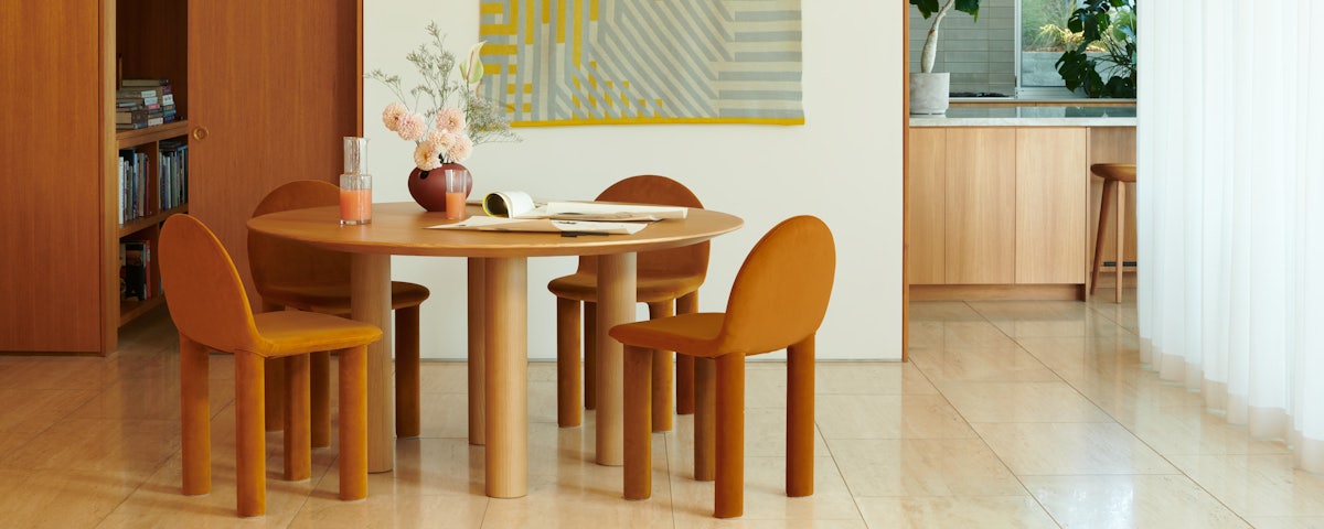 Earth Table and Arch Chairs in a dining room setting