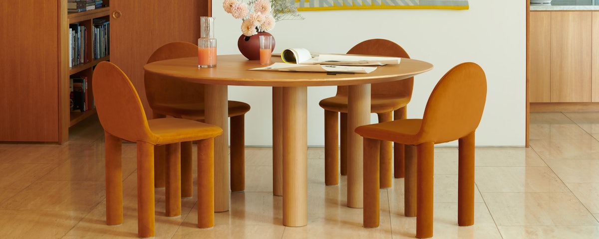 Earth Table and Arch Chair in a dining room setting