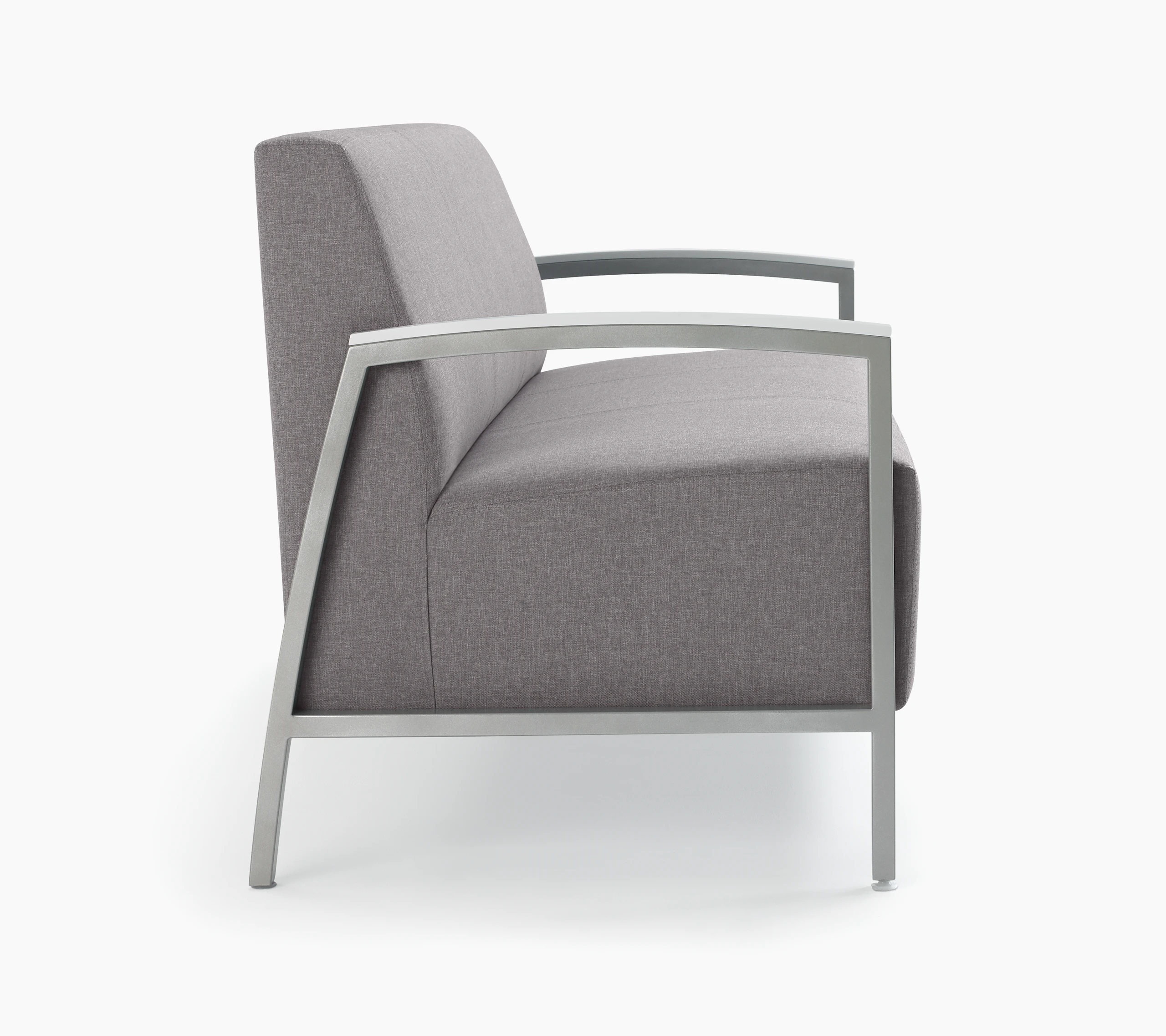 Side view of Brava Modern Lounge Seating (sofa) with solid surface arm caps.