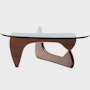 A Noguchi Table with a wood base and glass top.