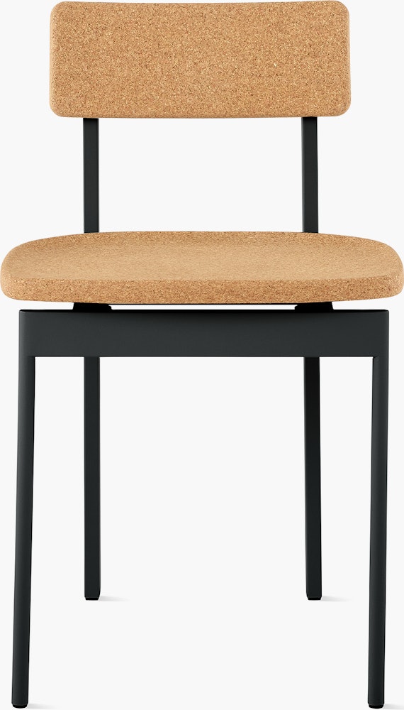 A cork Betwixt Chair with a black frame.