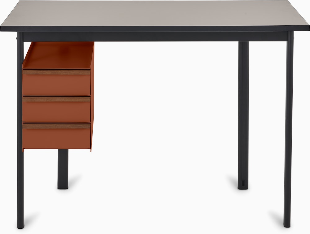 Mode desk in black with sandstone top and terracotta drawers.