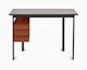Mode desk in black with sandstone top and terracotta drawers.