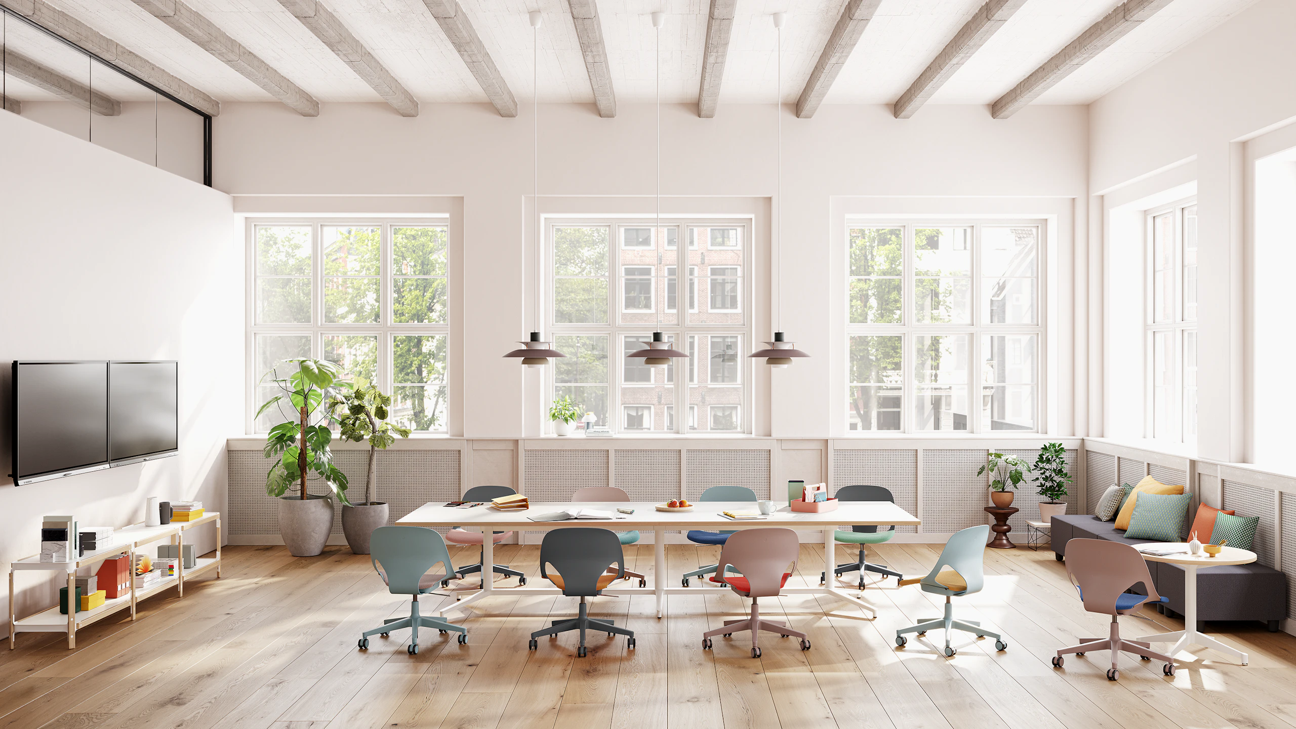 A meeting space featuring nine Zeph chairs in grey, light blue and light brown that surround a Headway table. and round side table.