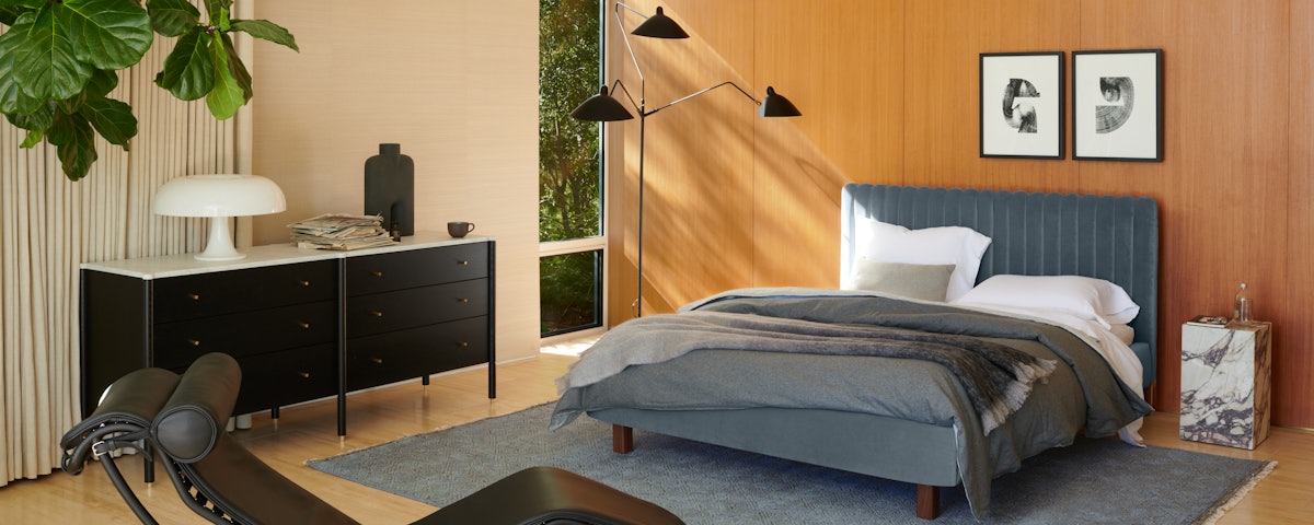 Nesso Table Lamp, Morrison Dresser, Charlotte Bed, and Serge Mouille Floor Lamp in a bedroom setting