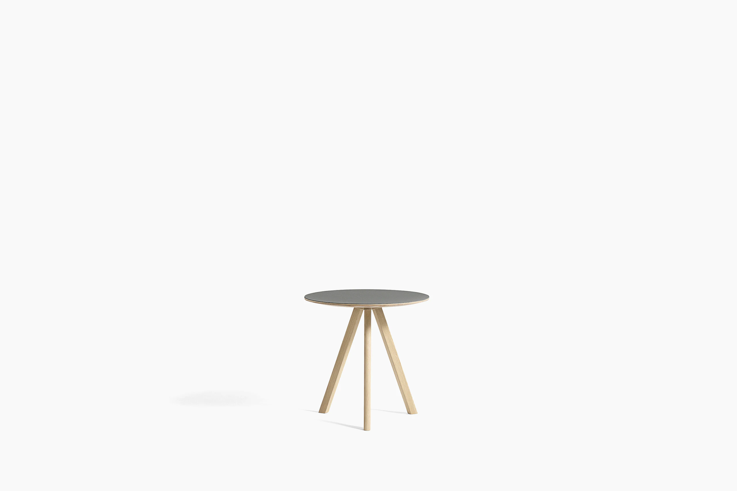 Grey Copenhague Side Table with oak base, viewed from the front.