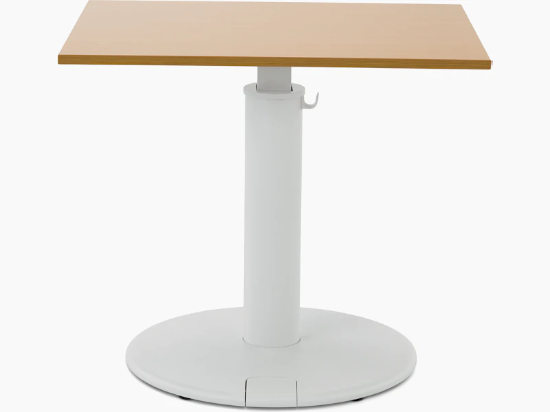 OE1 Sit-to-Stand Table with white base and brown rectangular surface, viewed from the front.