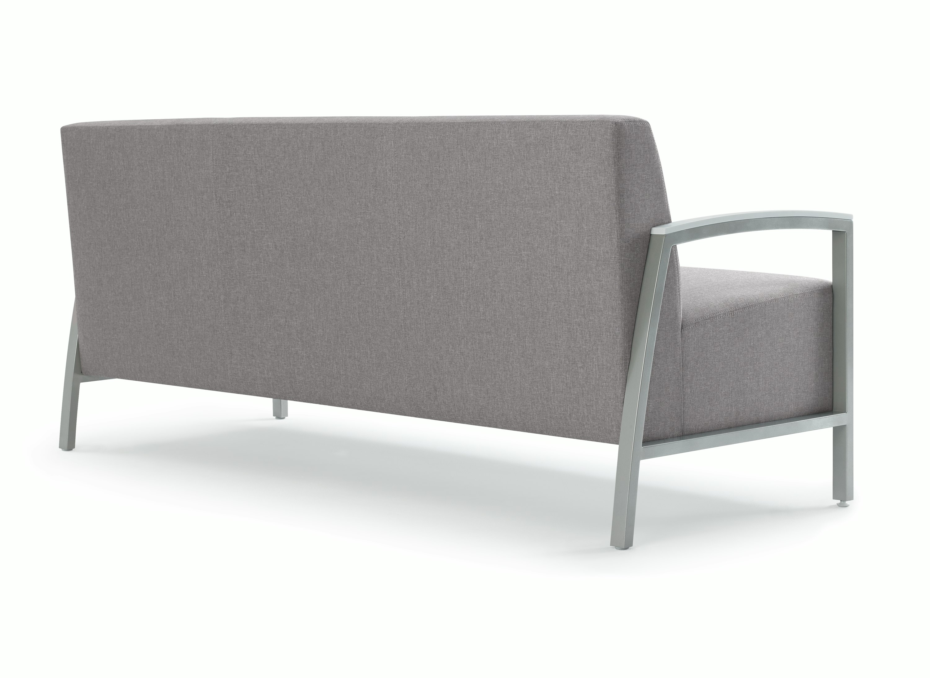 Back three-quarter view of Brava ModernLounge Seating (sofa) with solid surface arm caps.