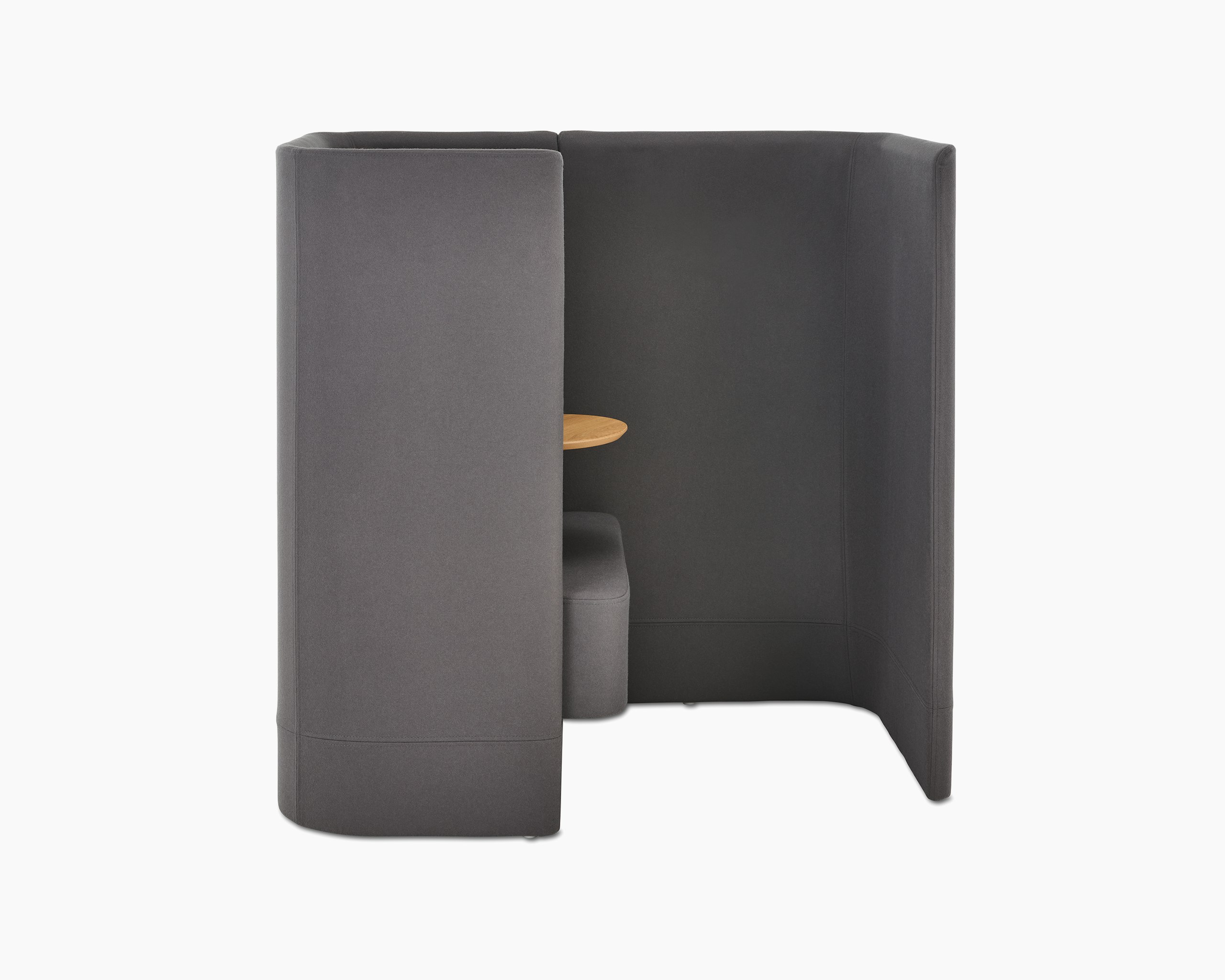 Whitesweep shot of Pullman Chair Pod upholstered in dark grey fabric, with tablet arm and screen left.