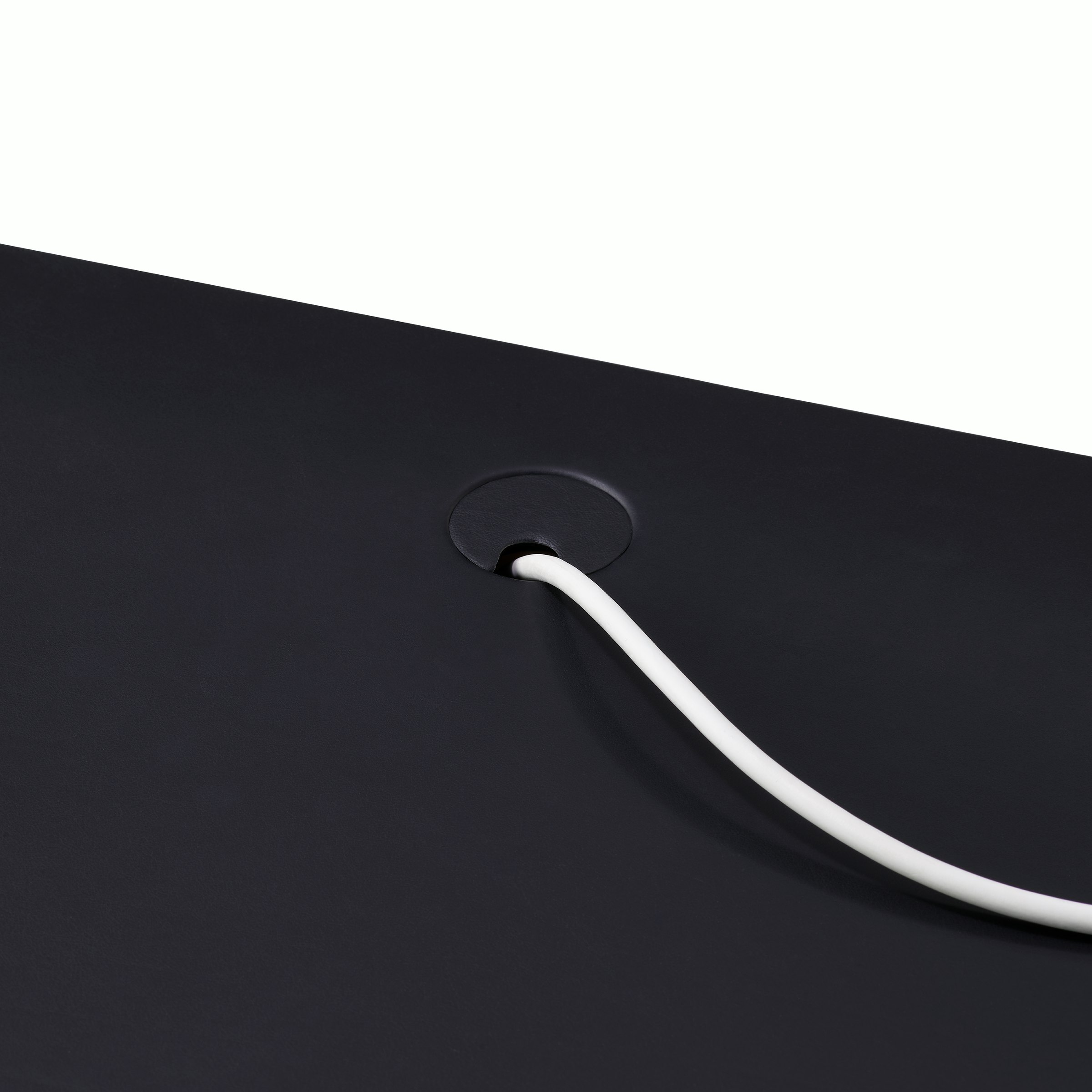 Leatherwrap Sit-to-Stand Desk, Leather Wrapped Grommet Detail.