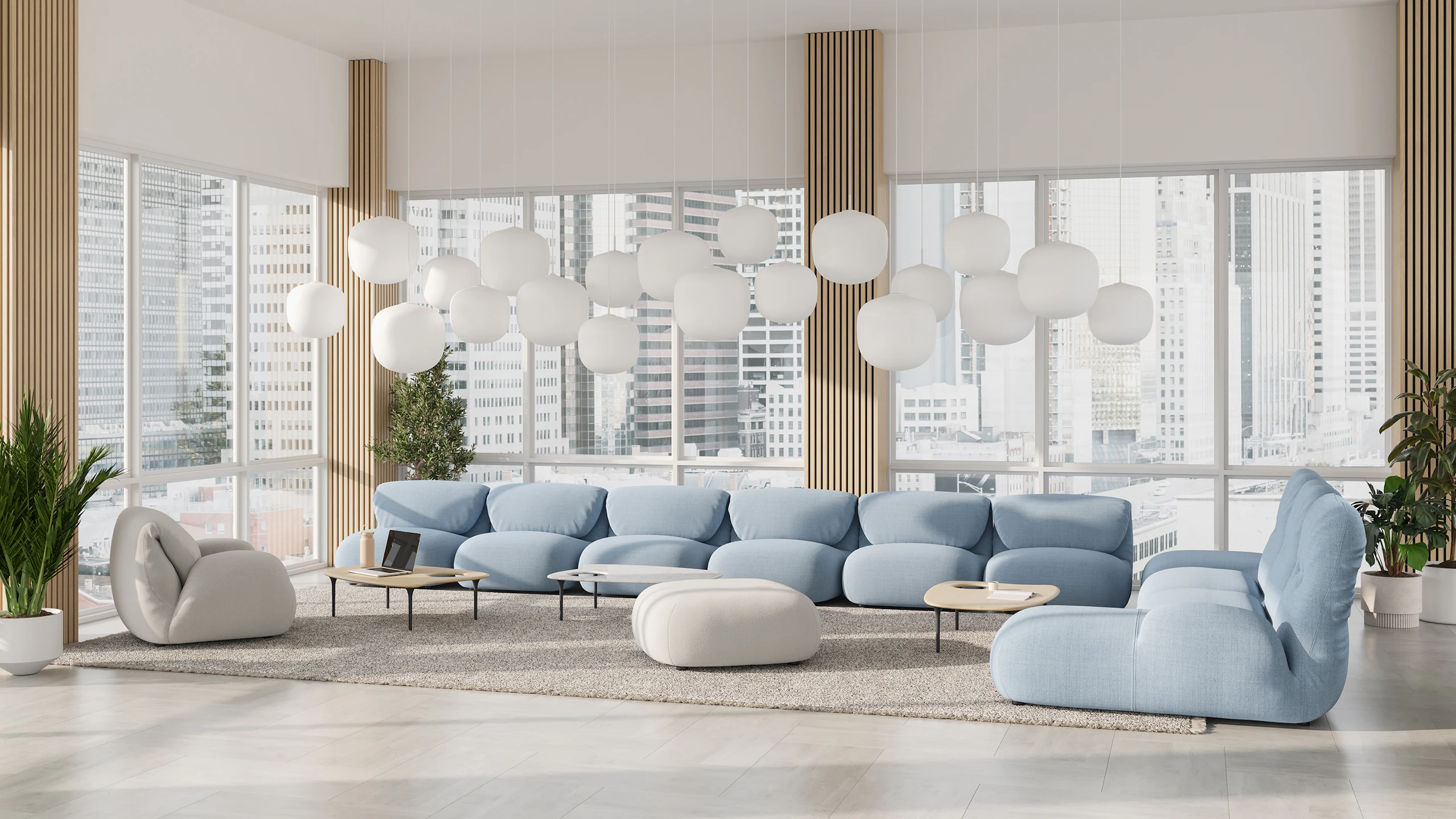 Luva Modular Sofa and Cyclade Tables in a commercial lounge setting