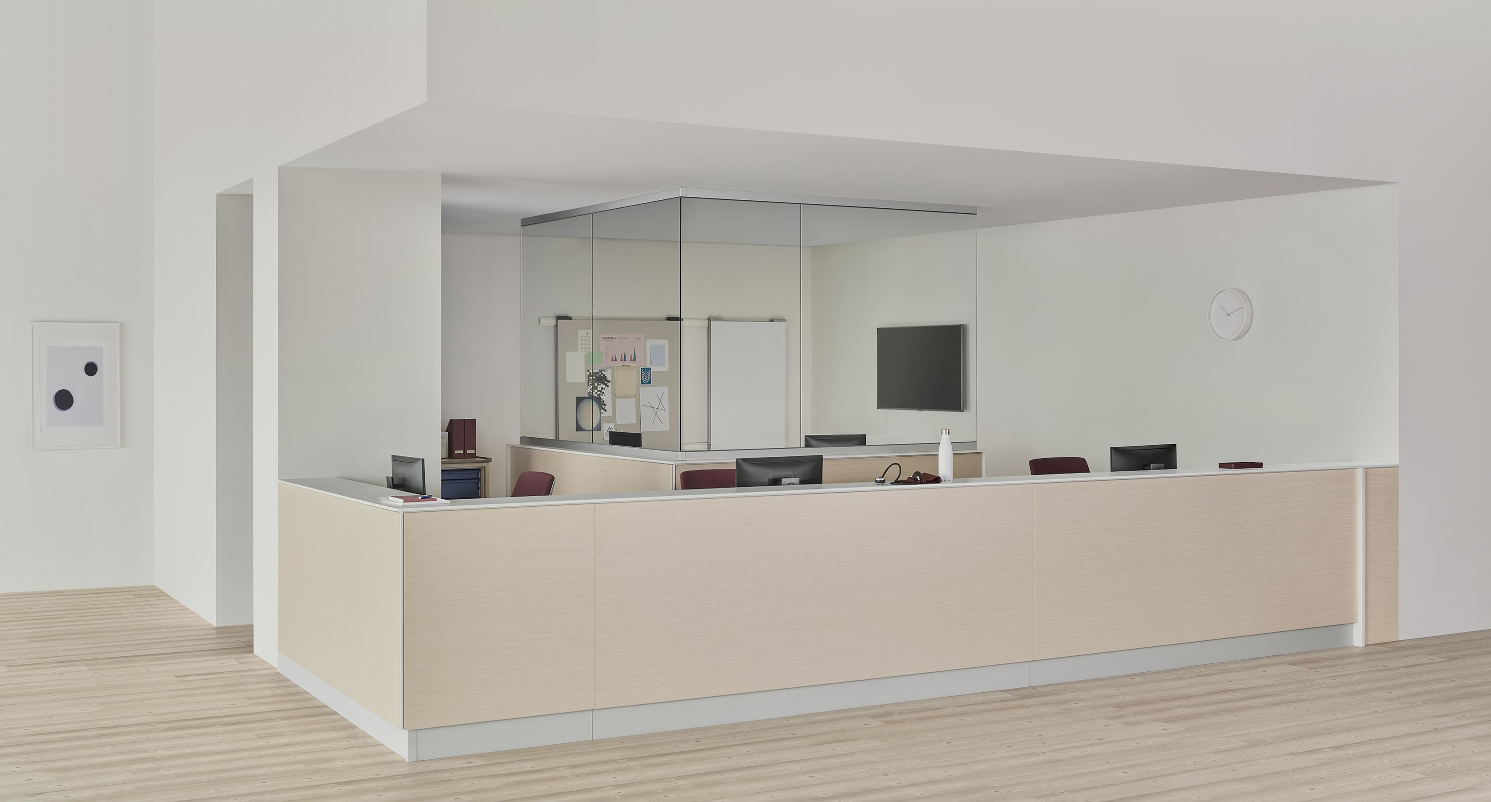 A caregiver environment with a Commend Nurses Station boundary wall and interior team zone defined by surface-to-ceiling glass.