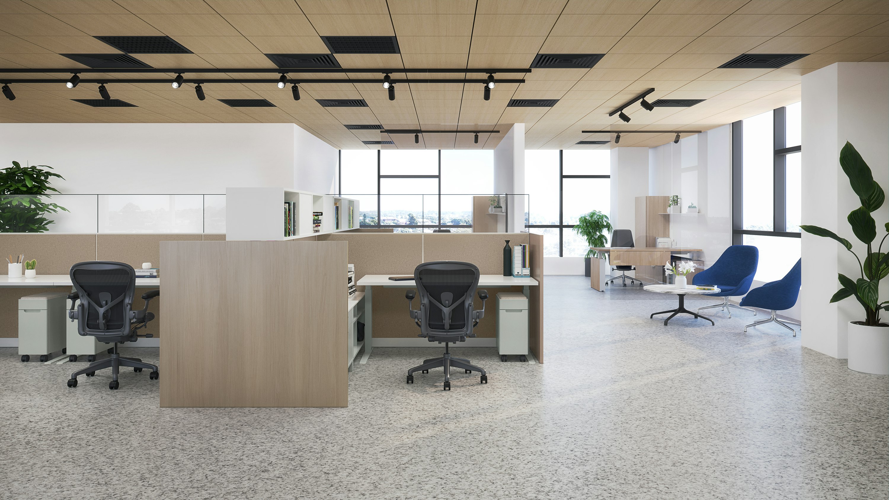 Traditional workplace showing a personal workspace with white Ambit Workspace Solutions product and black Aeron chairs.
