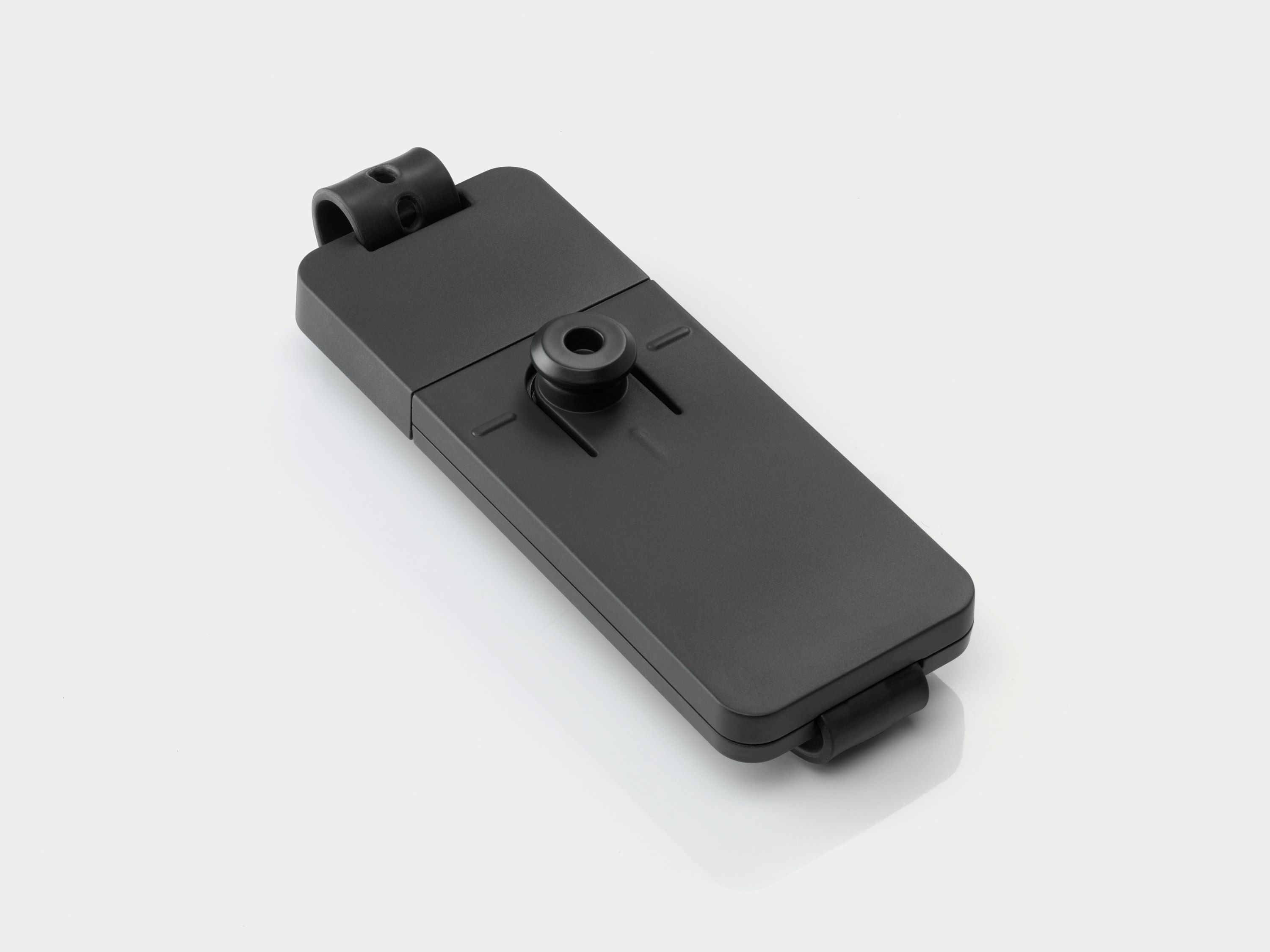 The top side of a compact Loop Micro Mount which would effortlessly attach to a bracket under a desk.