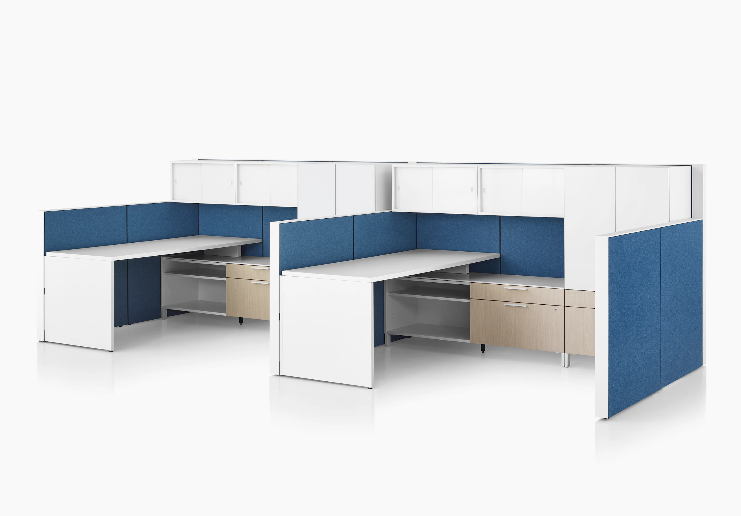 Canvas Wall workstation with blue panels and white overhead storage.