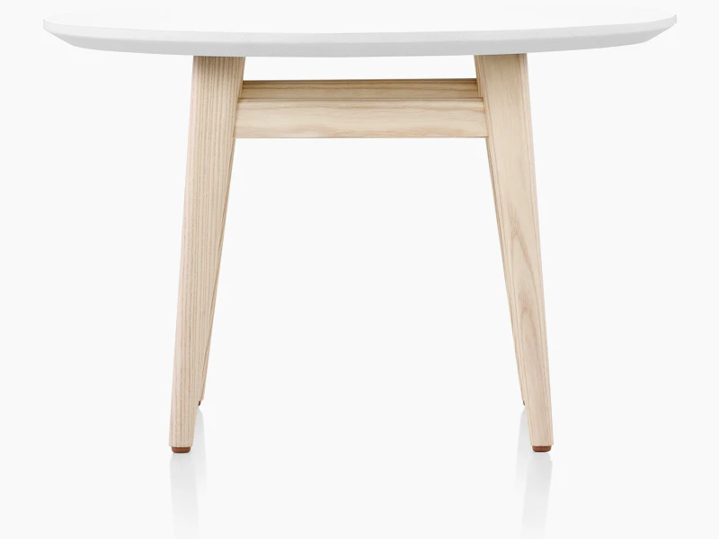 Palisade Occasional Table with wood legs and solid surface top on white sweep.