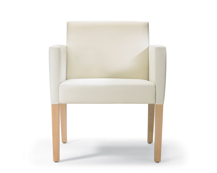 A front view of a Brava 862 Chair with maple frame, upholstered arm caps, and white textile.