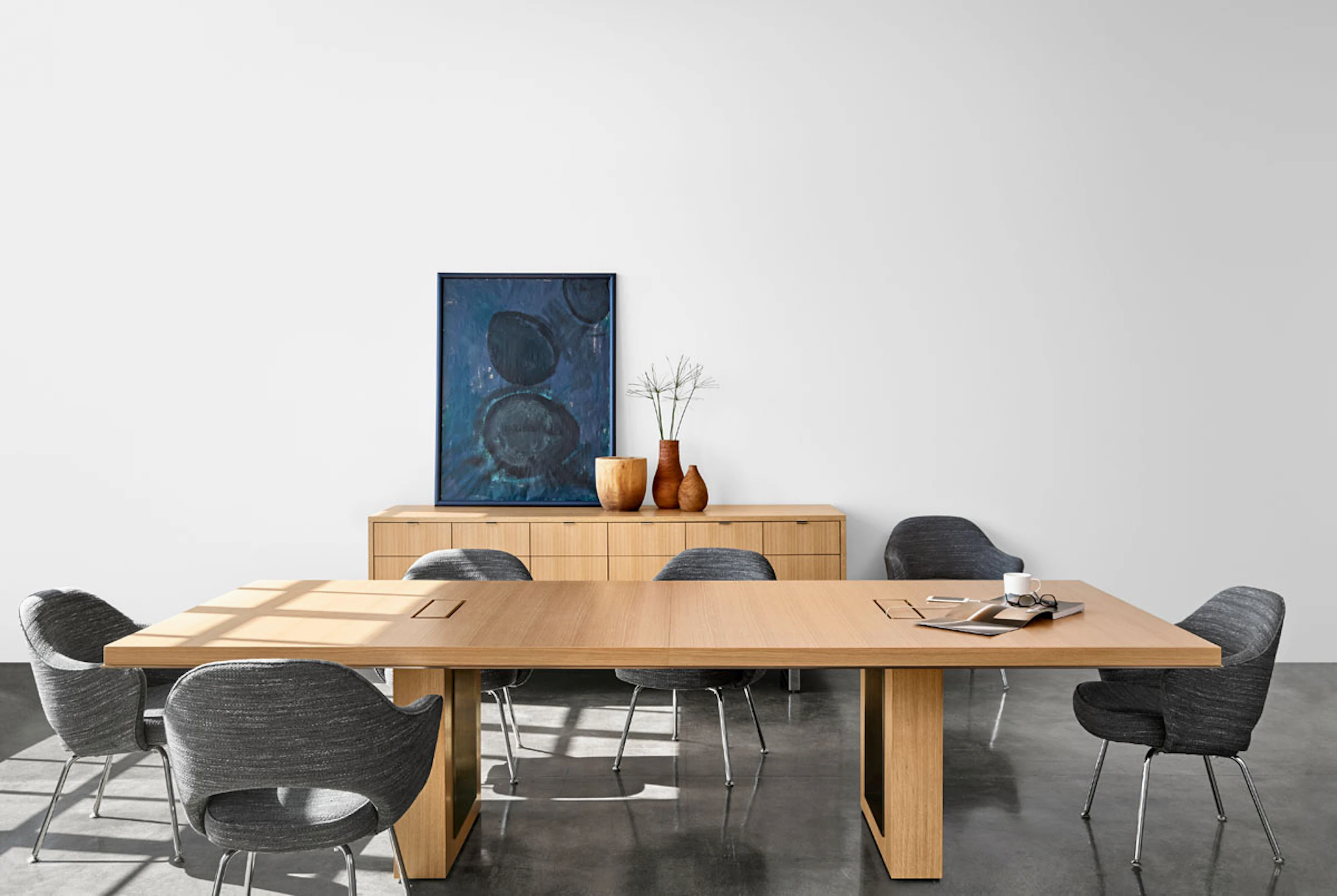 Highline 50 Conference Table in a Conference Room setting with Highline 25 Credenza, front view.