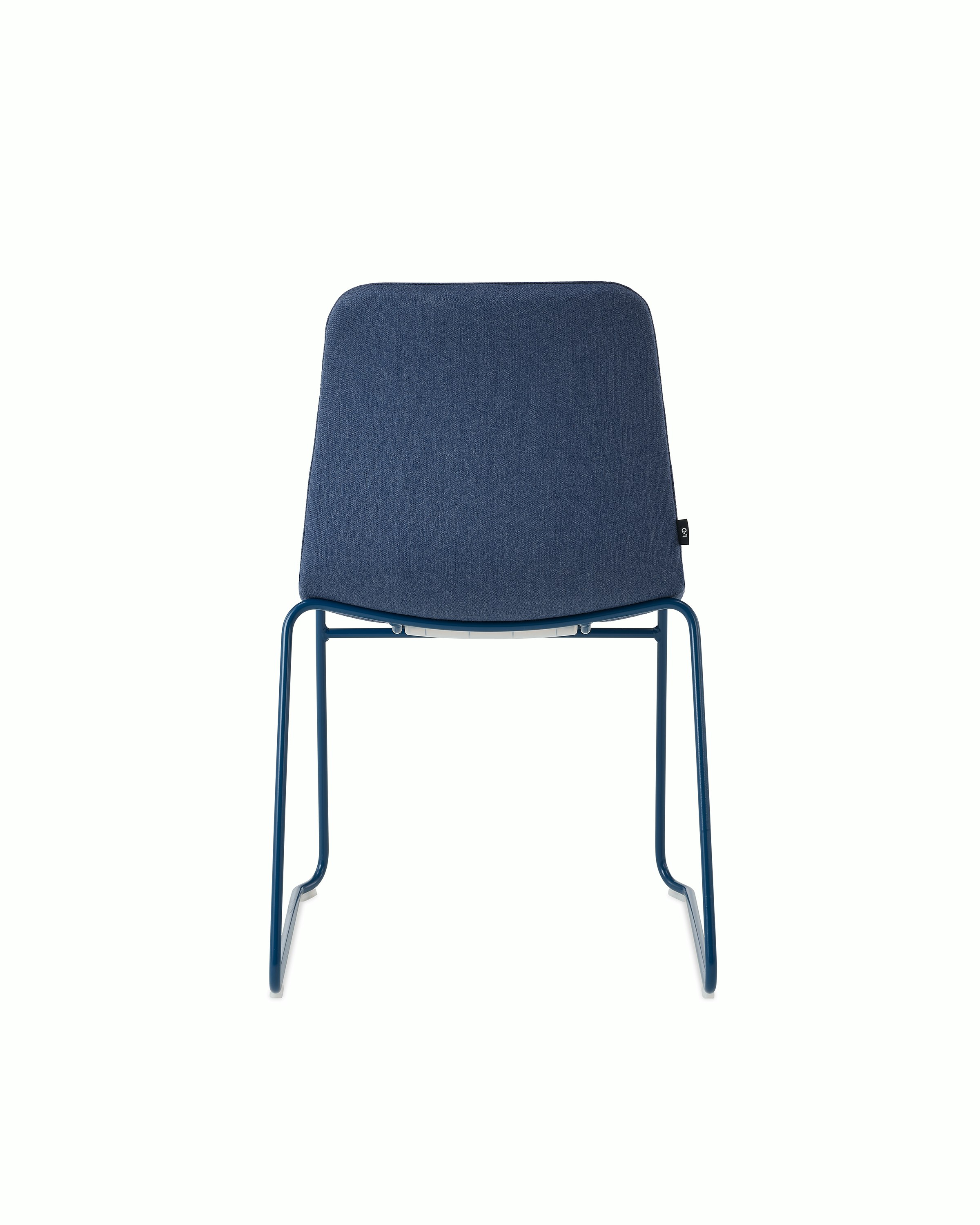 White sweep of Viv chair with dark blue fabric and dark blue steel sled base