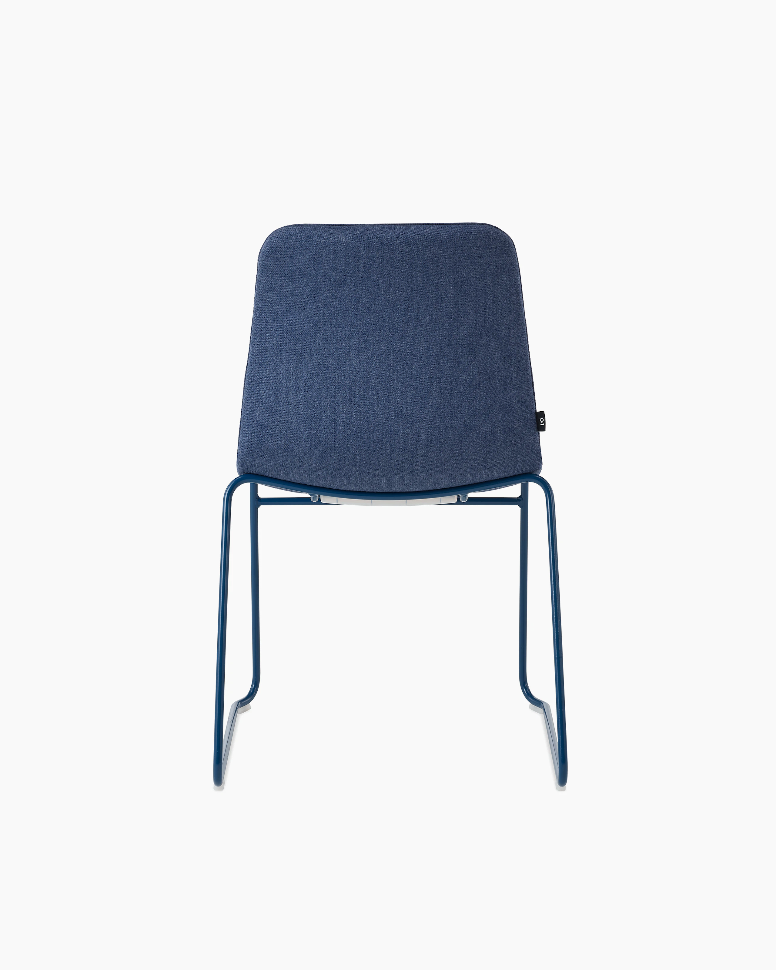 White sweep of Viv chair with dark blue fabric and dark blue steel sled base