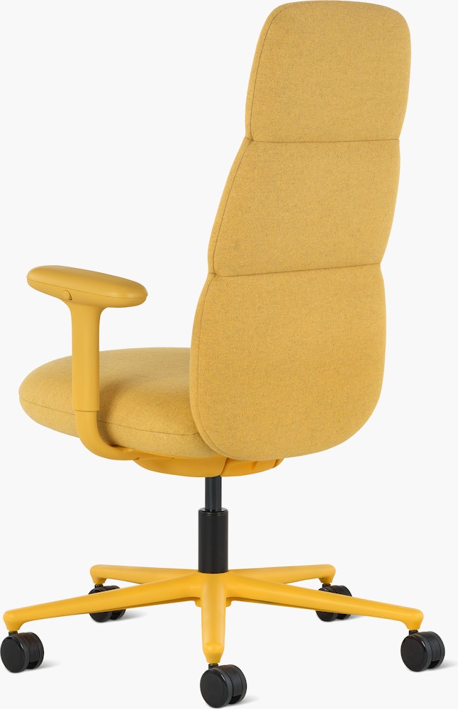 Rear angle view of a high-back Asari chair by Herman Miller in yellow with height adjustable arms.