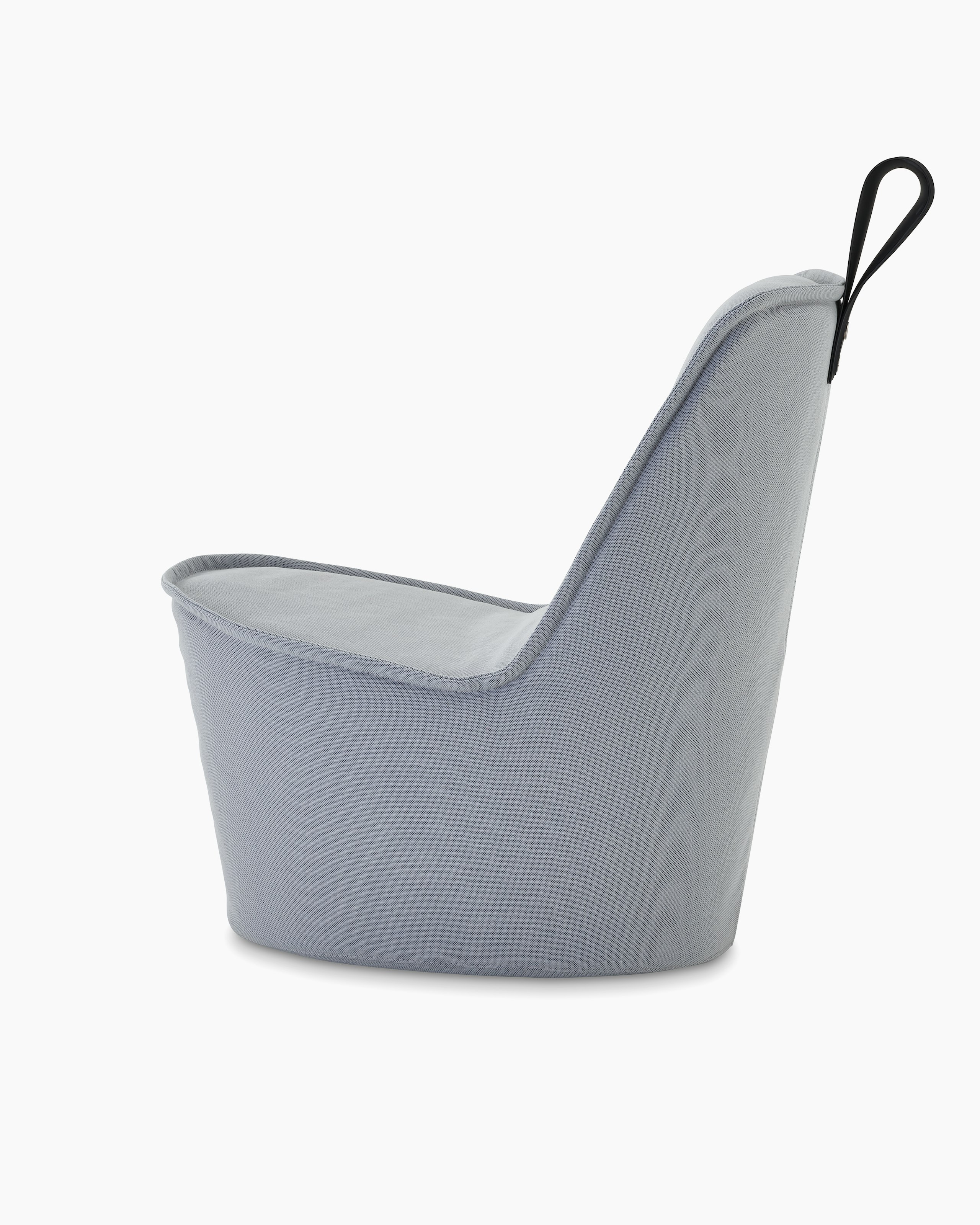 A grey upholstered lounge chair with black grey handle.