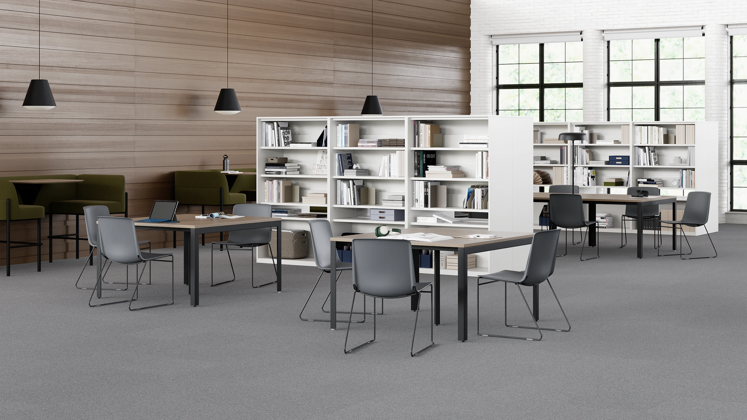 Grey Pronta Stacking Chairs in a library space with Layout Studio Tables and a naughtone Hue Booth.