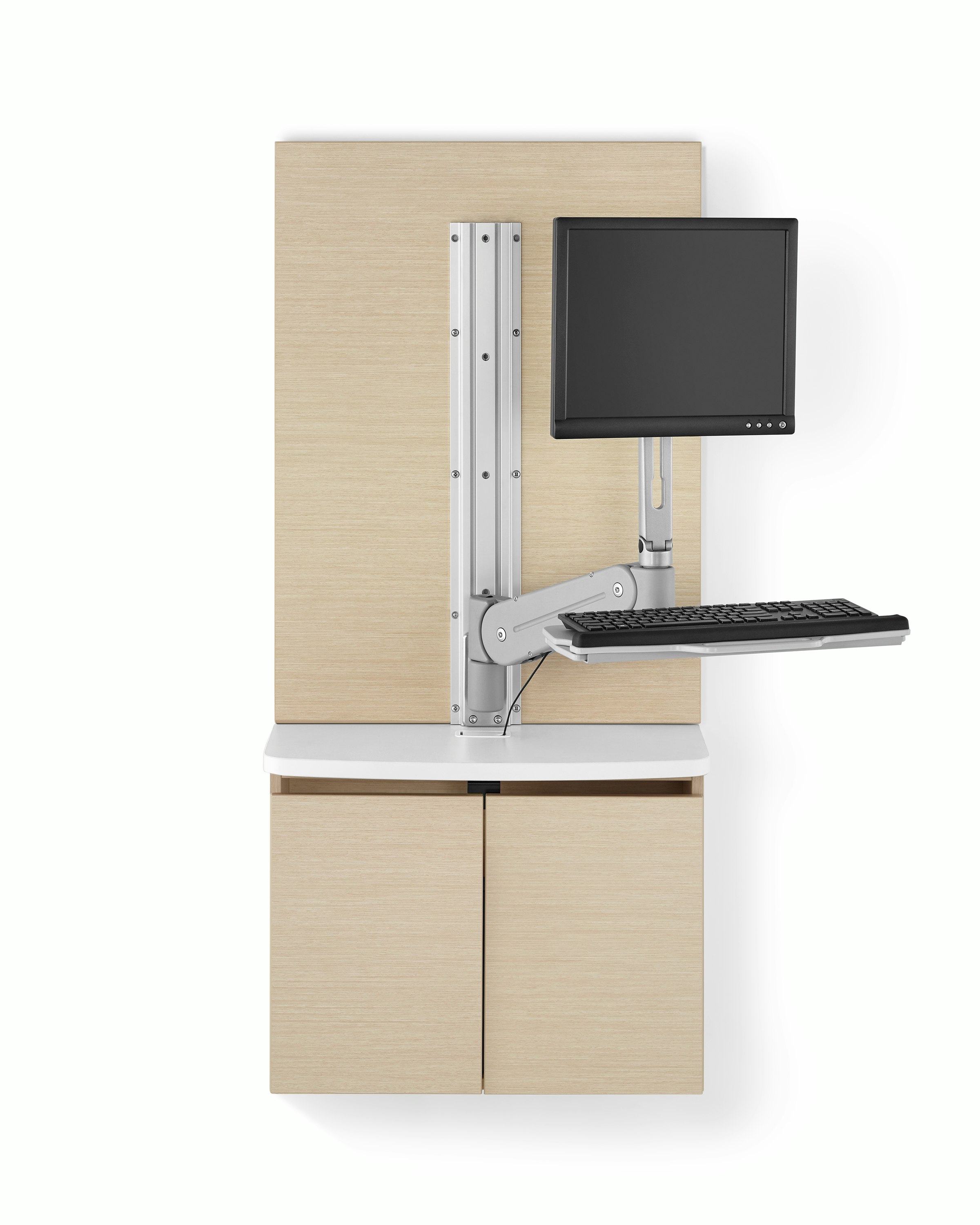 A Mora Systems casework technology cabinet in an ash finish with a white solid surface top, and an MBrace monitor and keyboard support attached to it.