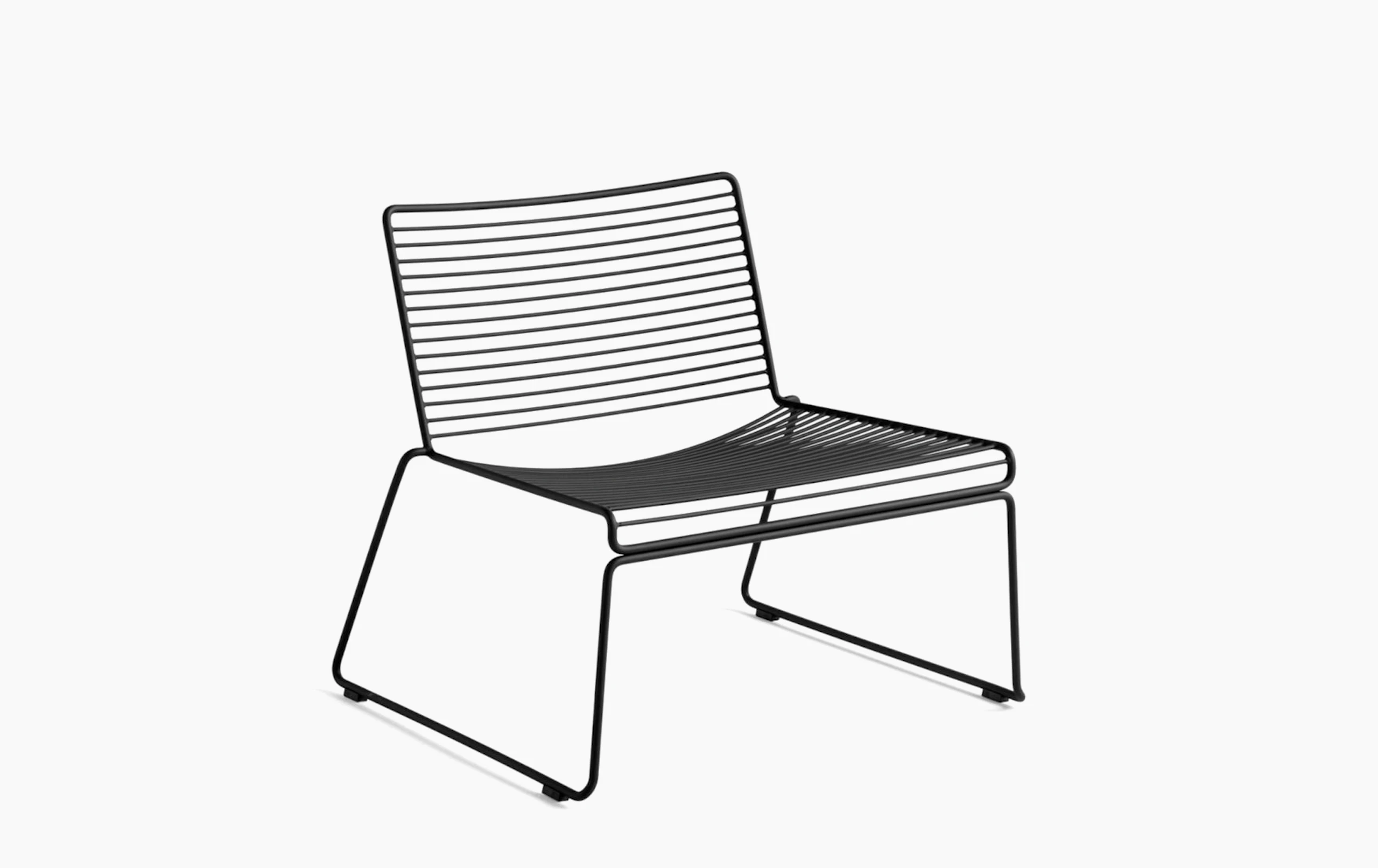 A three quarter side view of a black Hee Lounge Chair.