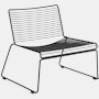 A three quarter side view of a black Hee Lounge Chair.