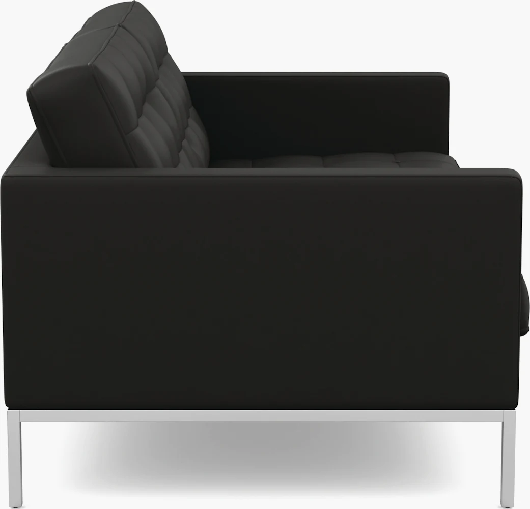 Back view of a black modern sofa with metal legs.