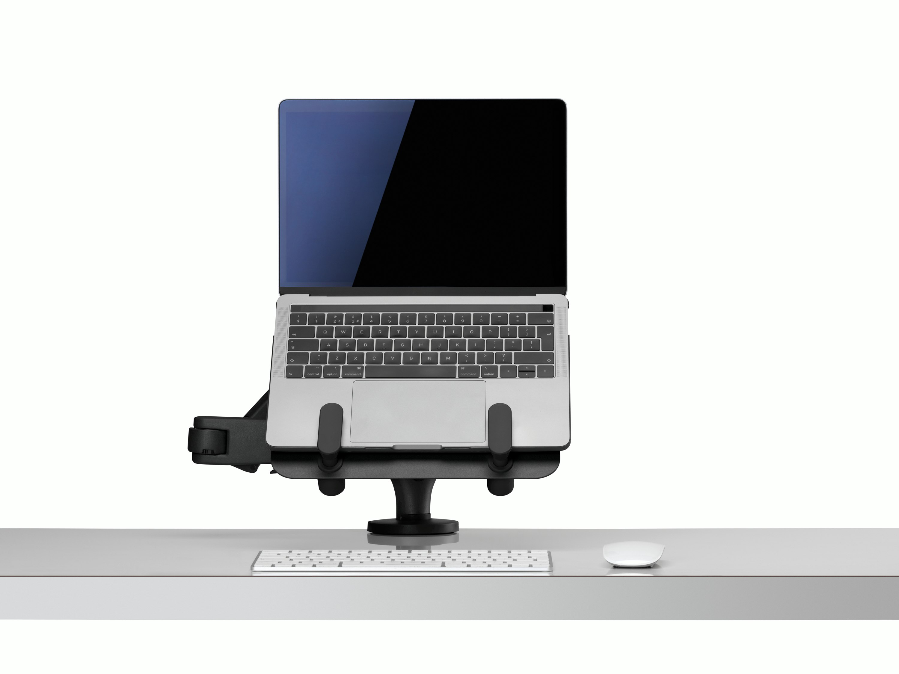 Front view of an open laptop raised and supported by an Ollin Laptop and Tablet Mount connected to an Ollin Monitor Arm.