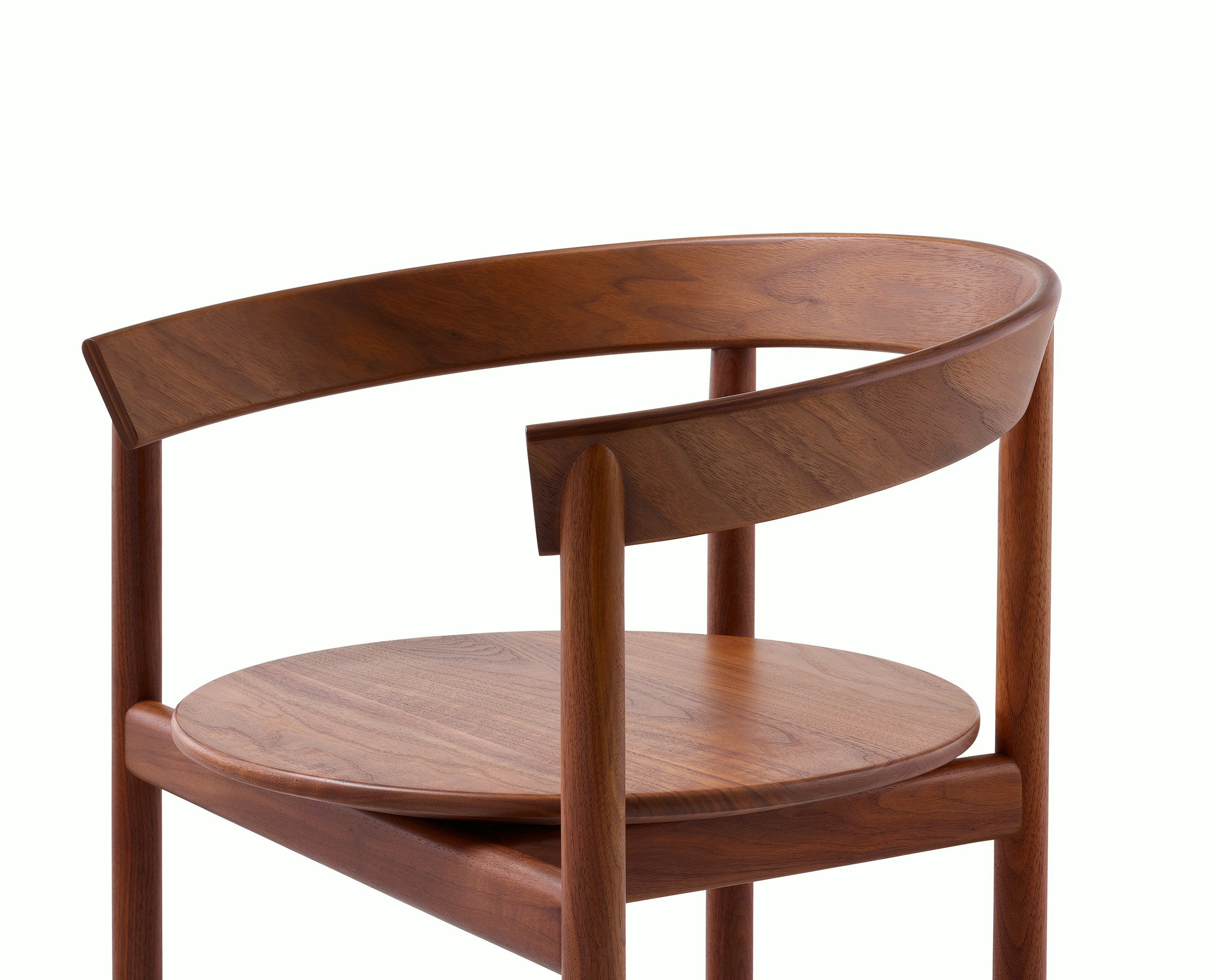 Detail shot of a Comma Chair with arms highlighting the solid frame.