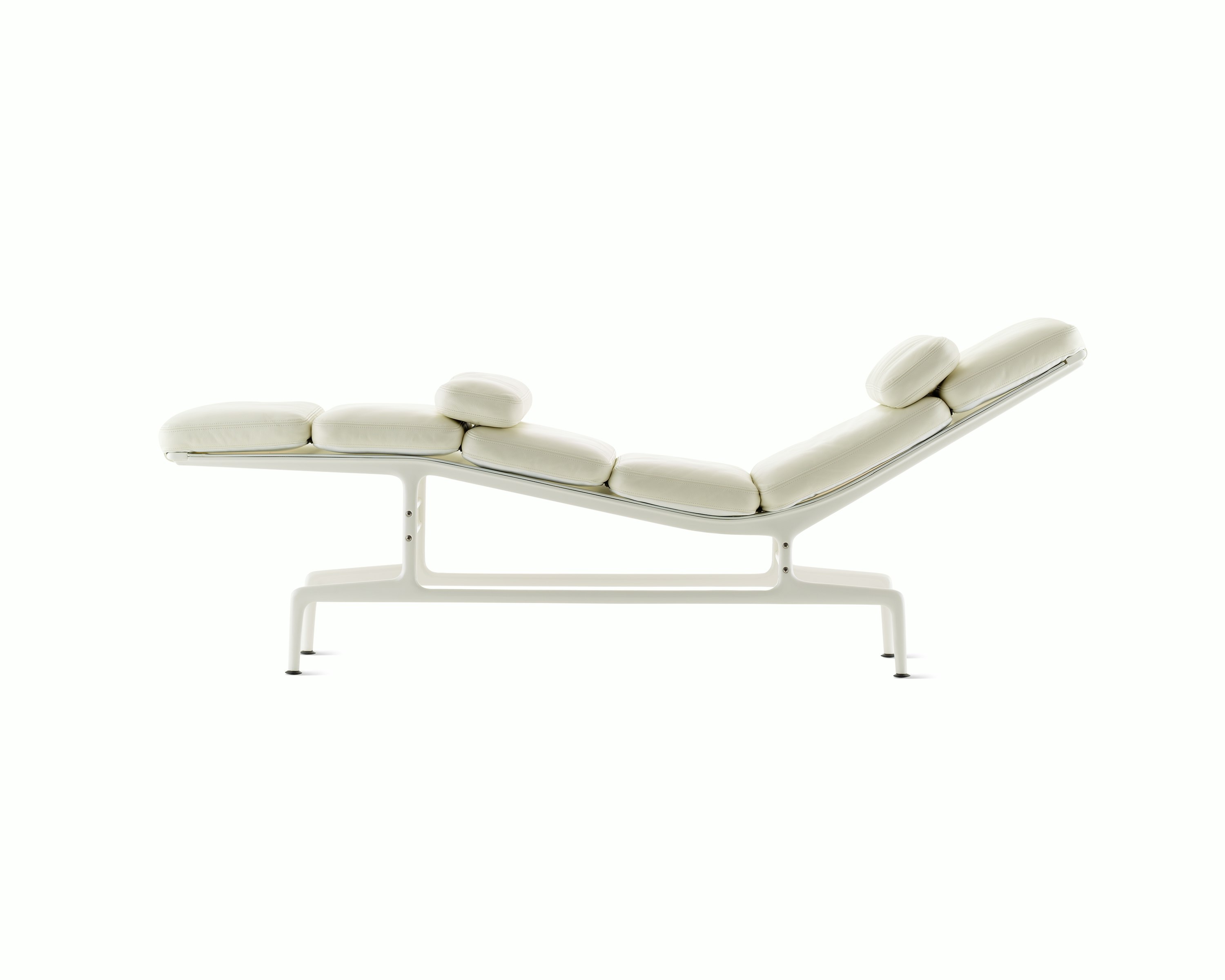 Profile view of an all-white Eames Chaise.
