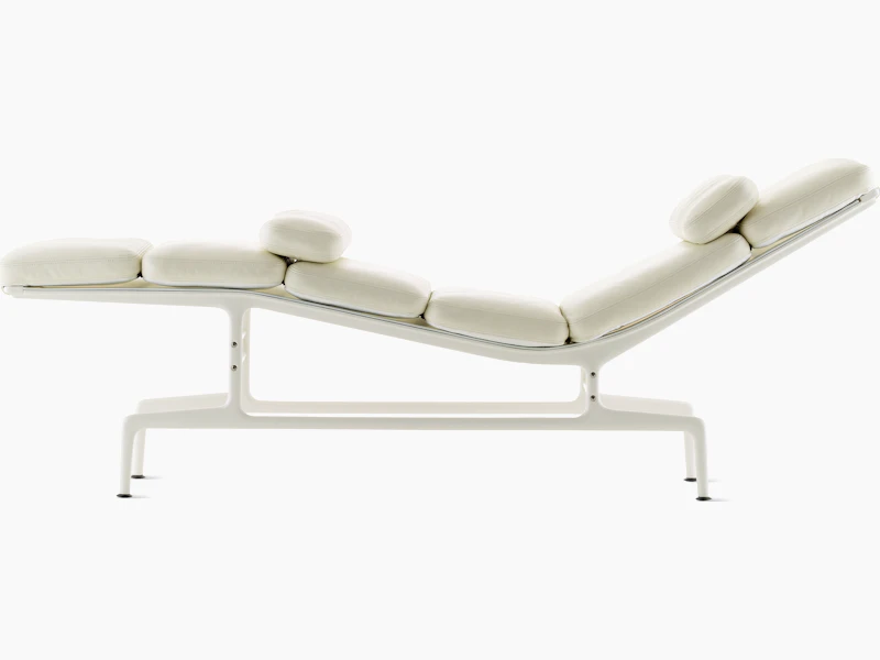Profile view of an all-white Eames Chaise.