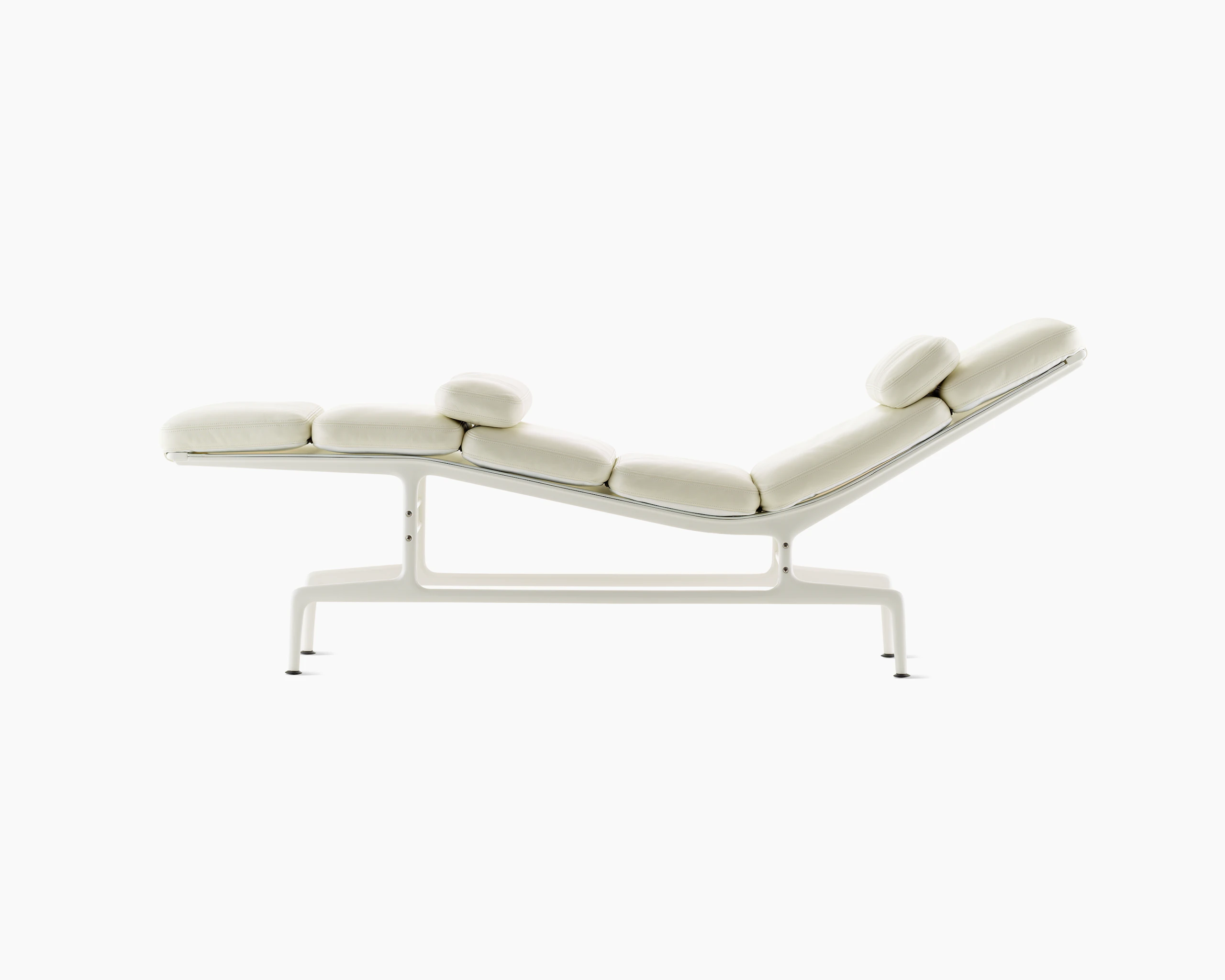 Profile view of an all-white Eames Chaise.