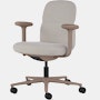 Front angle view of a mid-back Asari chair by Herman Miller in light brown with height adjustable arms.