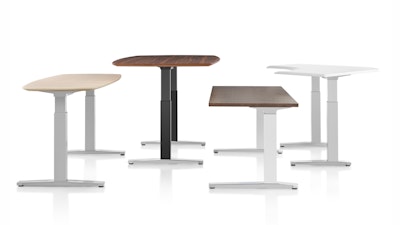An assorted grouping of four Renew sit-to-stand tables by Herman Miller