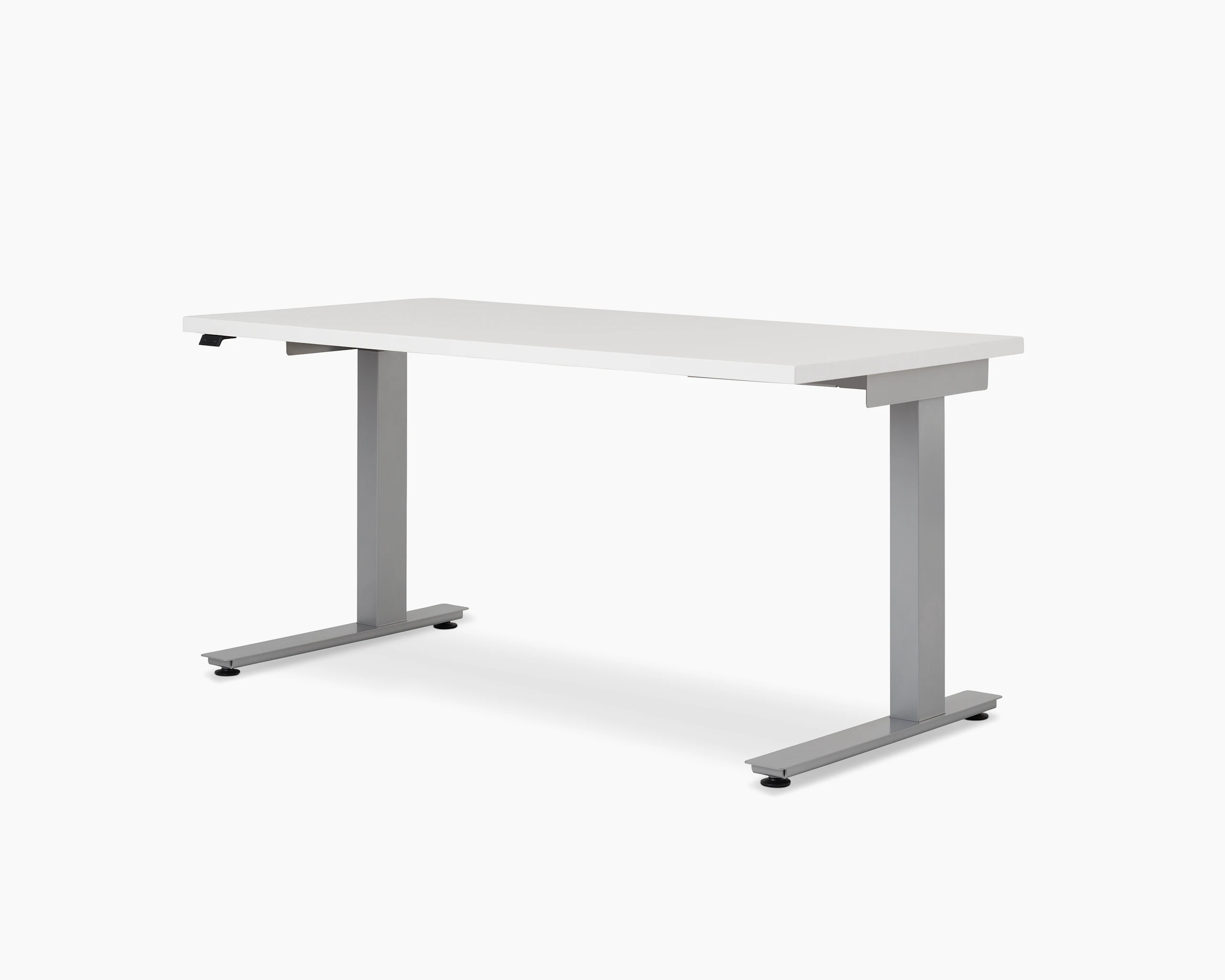 Lev Height Adjustable Table with core laminate studio white, viewed at an angle.