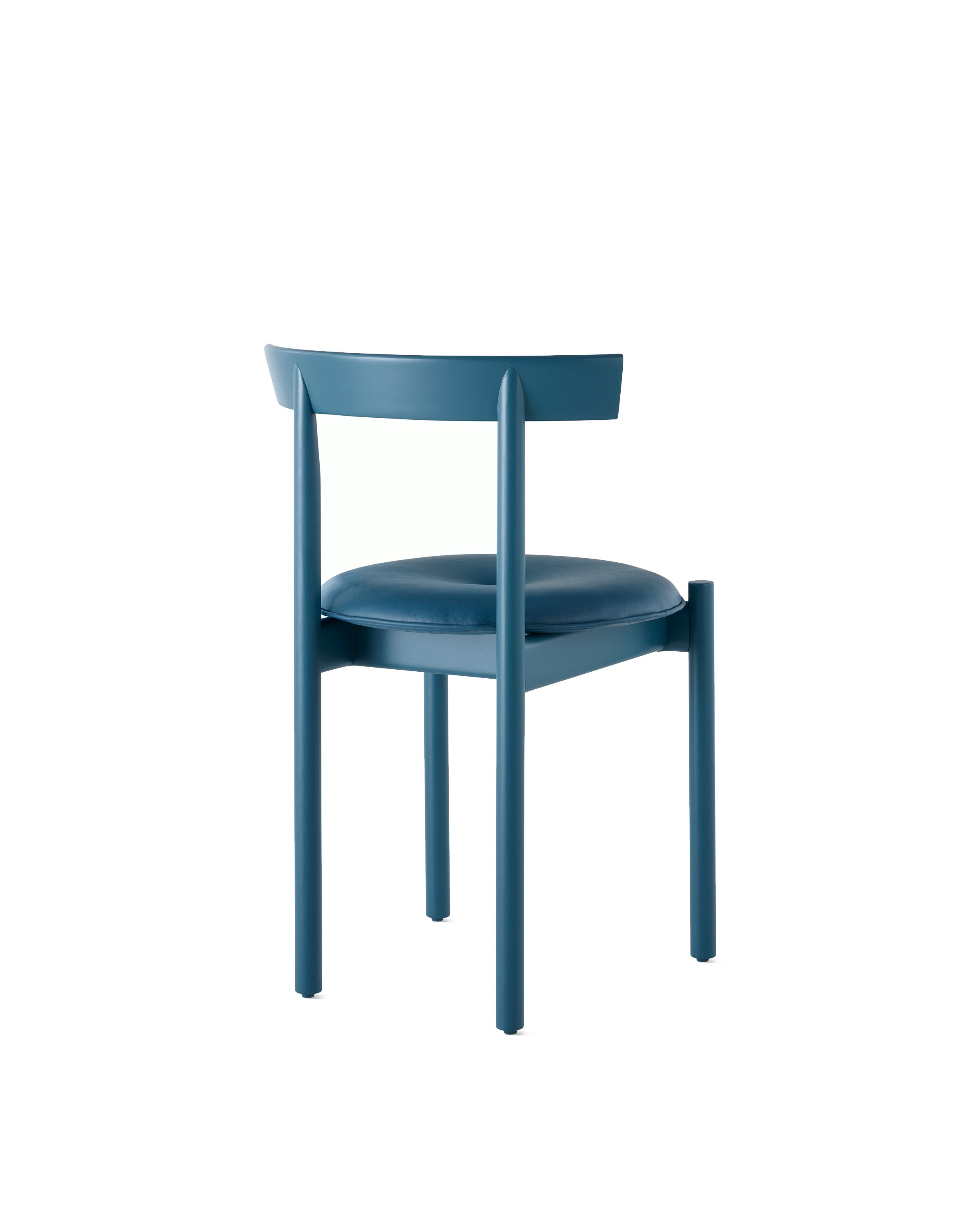 A blue Comma Chair with a seat pad, viewed from the back at an angle.